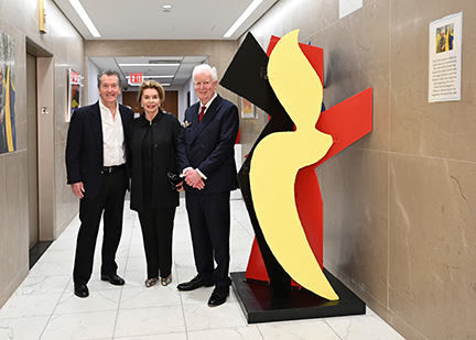 Patrick O’Toole, Elizabeth Dingman, and David M. Hayes beside a David Hayes sculpture at Rockefeller Center